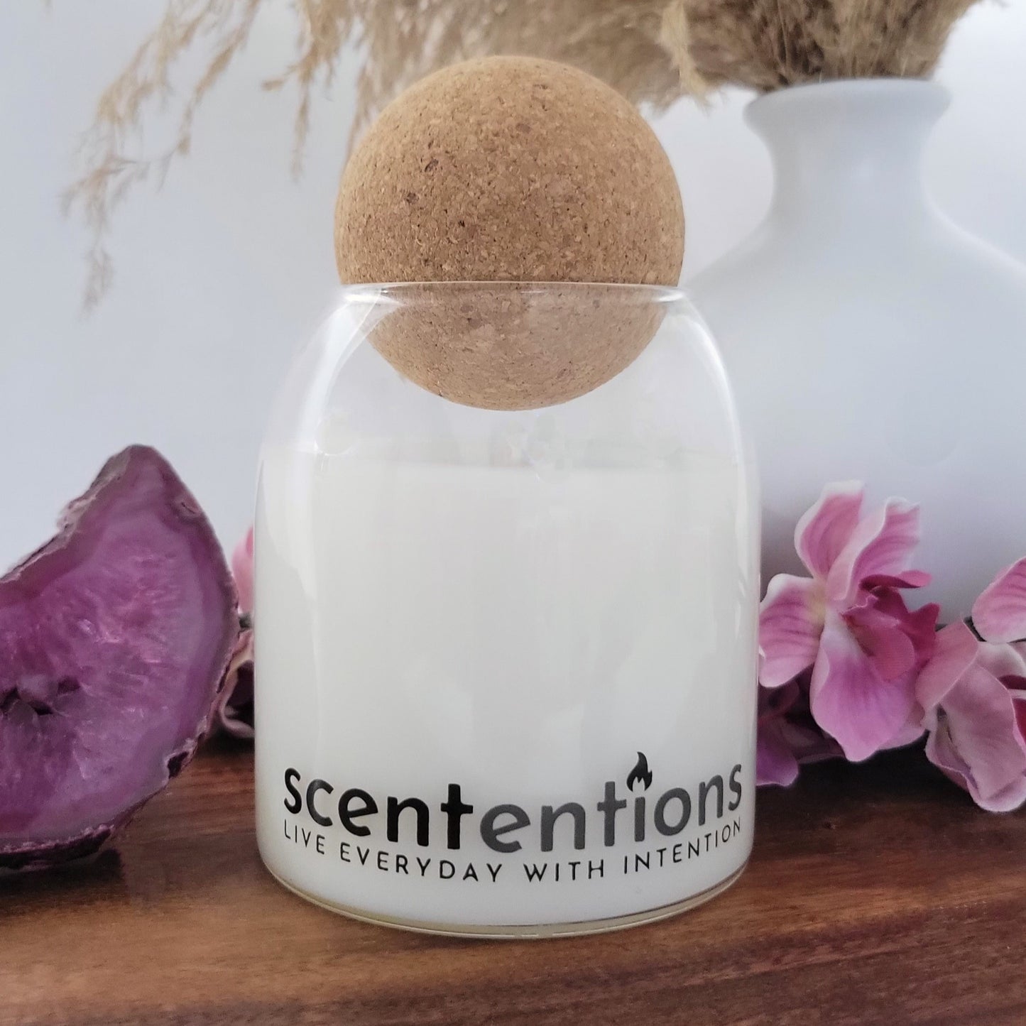 Balance + Bliss candle in reusable canvas tote, made with organic coconut wax, featuring ozone, sea salt, sweet blossoms, tonka, musk, and amber.