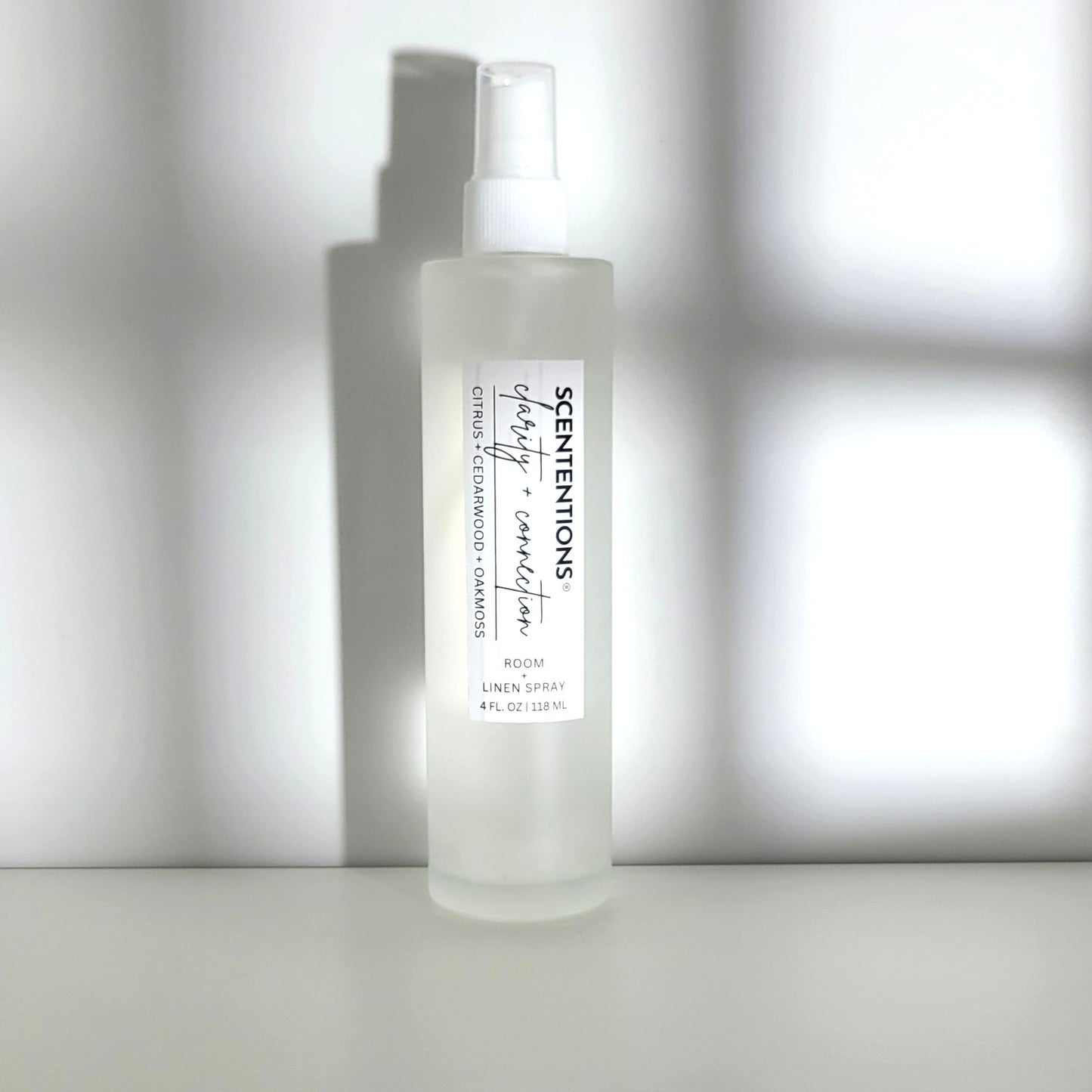 Clarity + Connection room spray featuring citrus, cedarwood, and oak moss notes for mental focus, clarity and grounding
