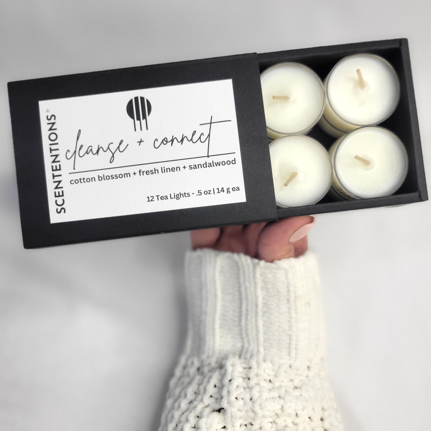 Cleanse + Connect Tea Light Set with cotton blossom and sandalwood scent in a serene setting by Scententions