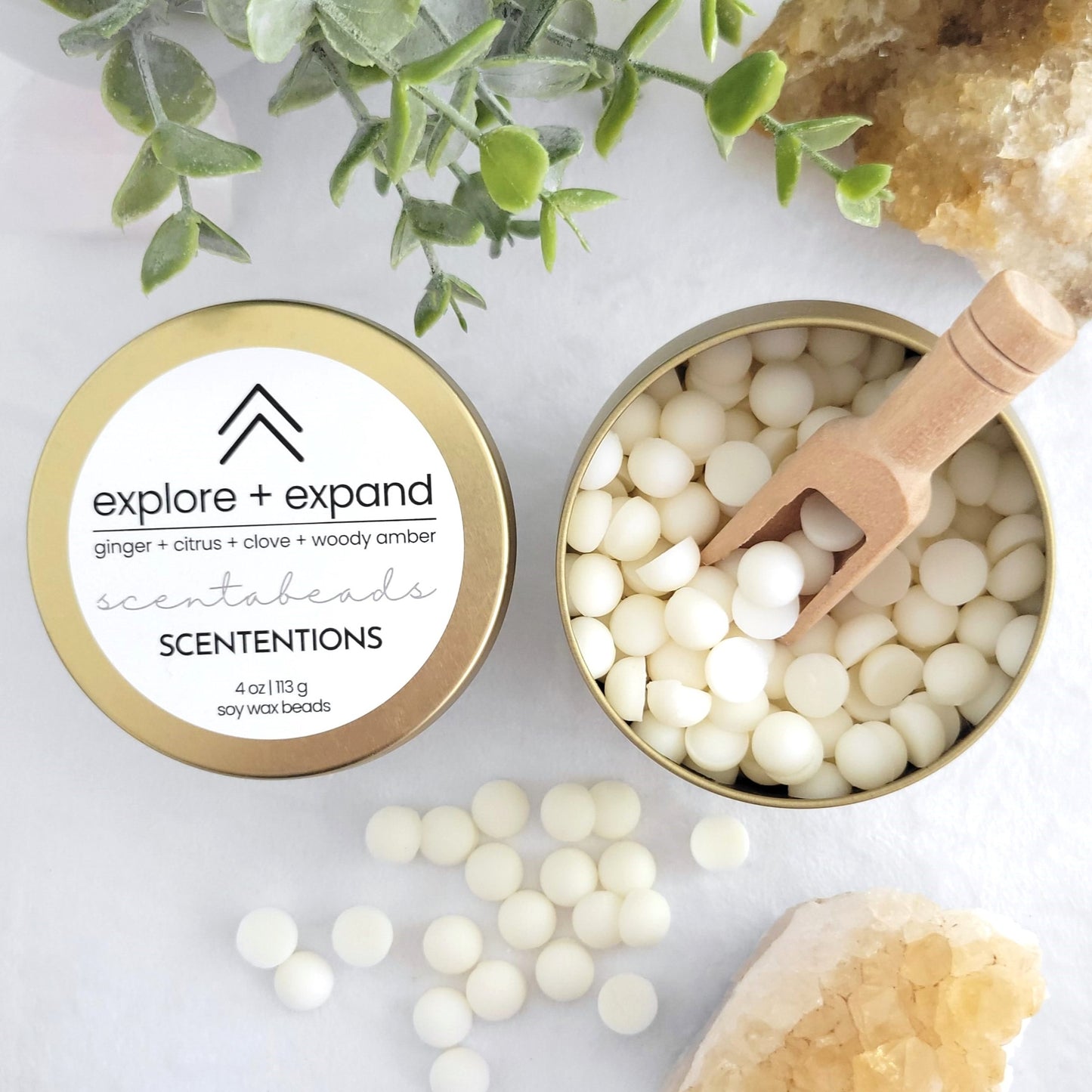 Explore + Expand soy wax melt beads with Citrus, Ginger, and Amber Cedar for energizing and adventurous aromatherapy by Scententions.