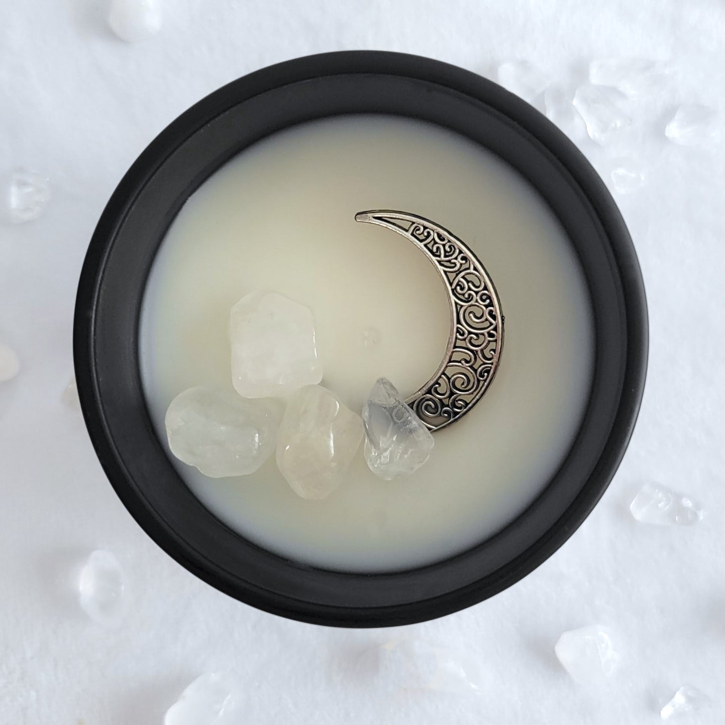 Top view of Moon Collection candle showing clean-burning organic coconut wax and clear quartz crystals.