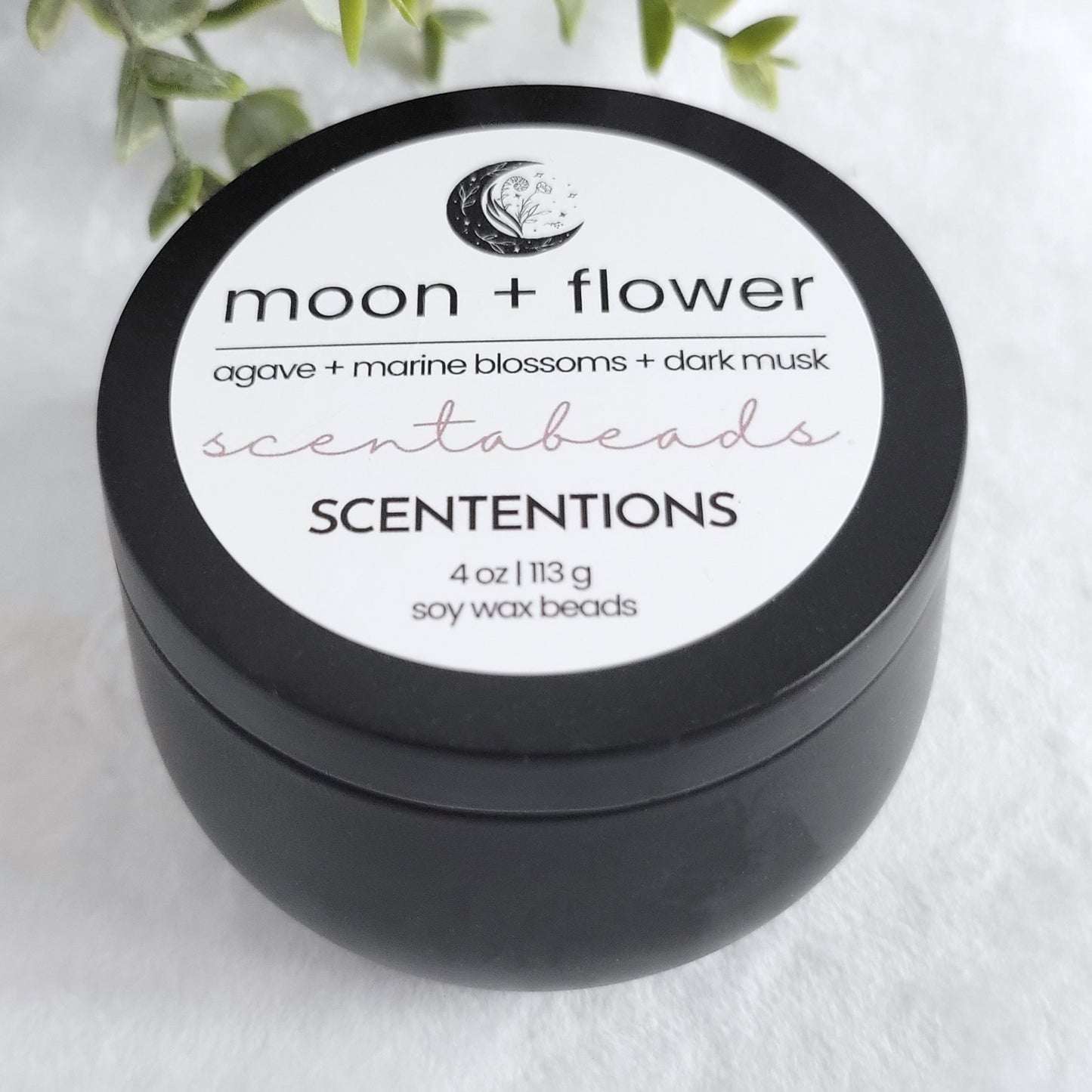Moon + Flower wax melt beads in eco-friendly tin with nurturing floral and musk scent blend