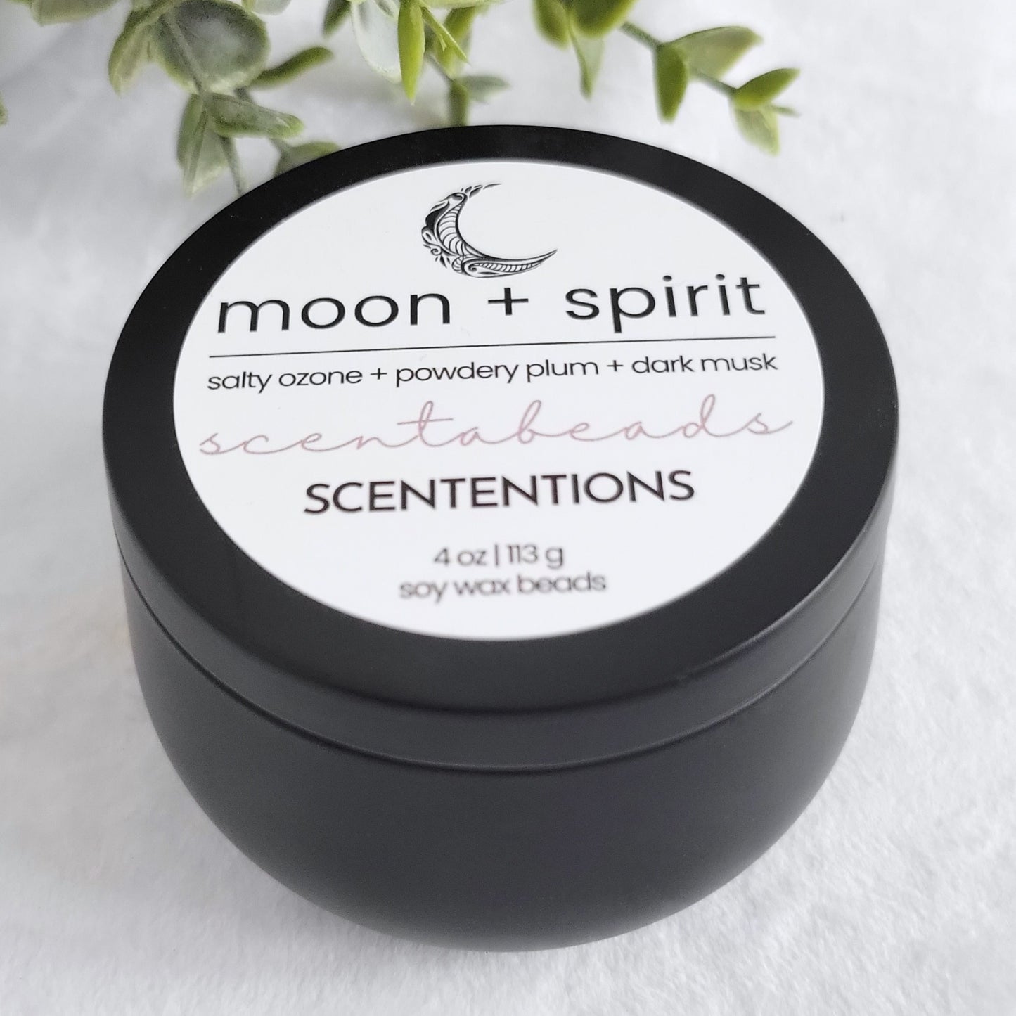 Moon + Spirit wax melt beads in reusable tin with serene scent blend and wooden scoop