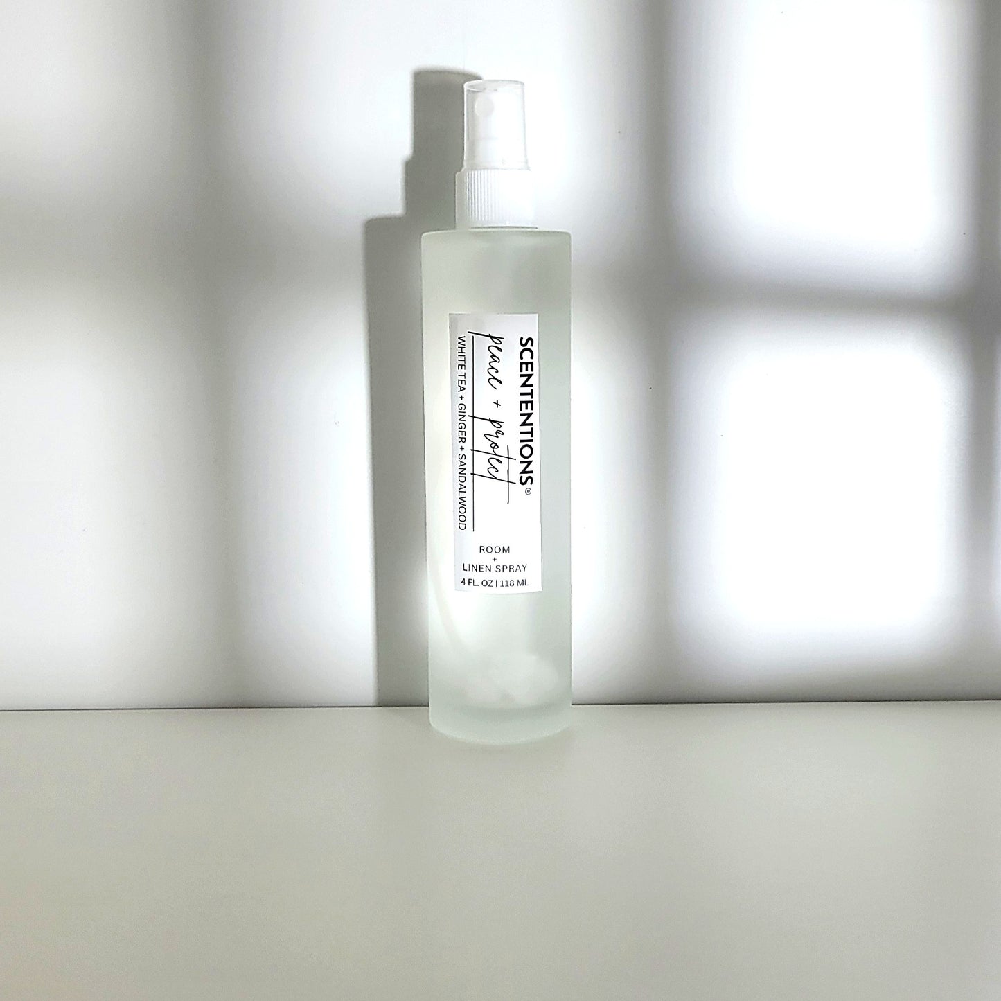 Peace + Protect room spray with white tea, ginger, and sandalwood notes for grounding, tranquility and protection