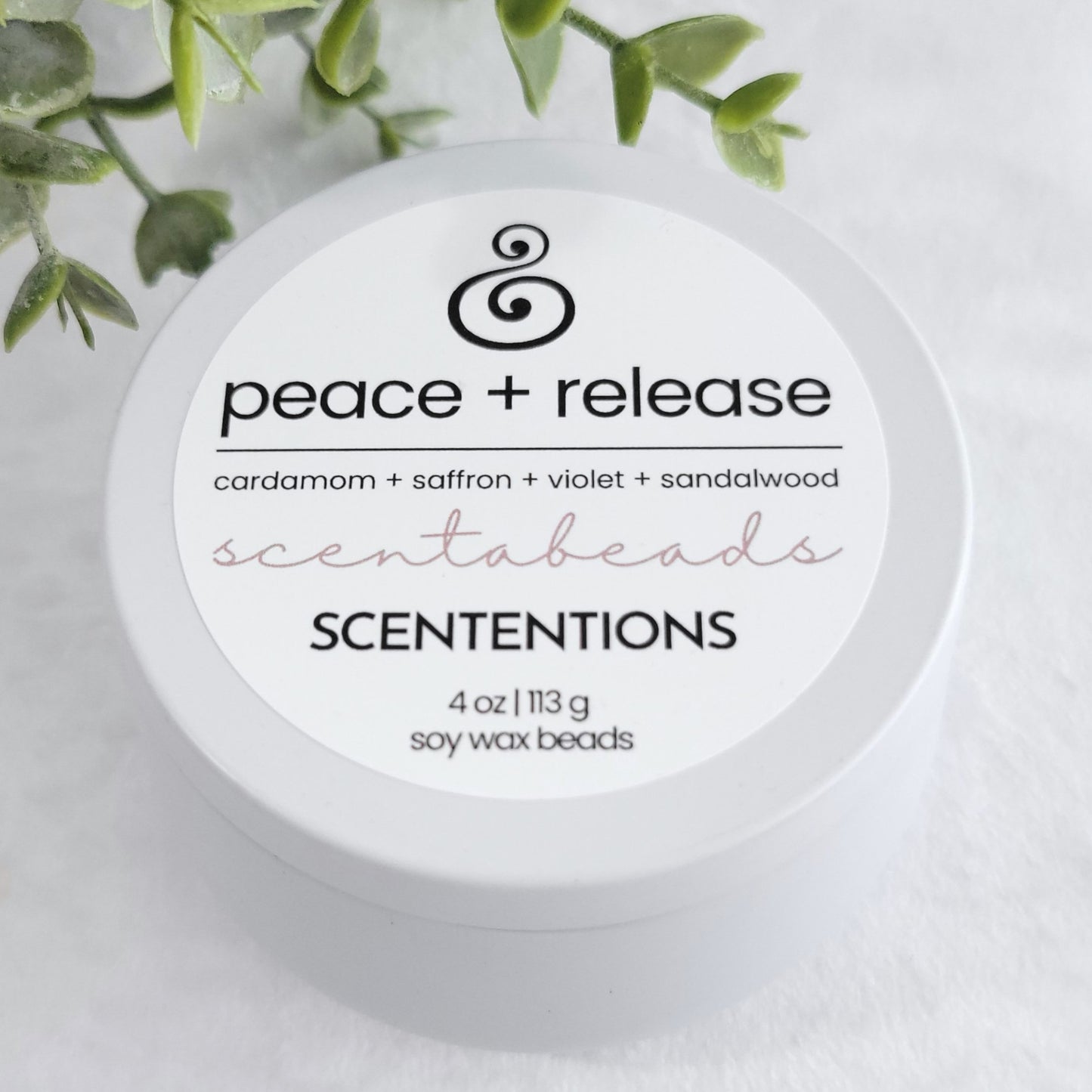 Peace + Release wax melt beads with Citrus, Cardamom & Palo Santo in eco-friendly packaging