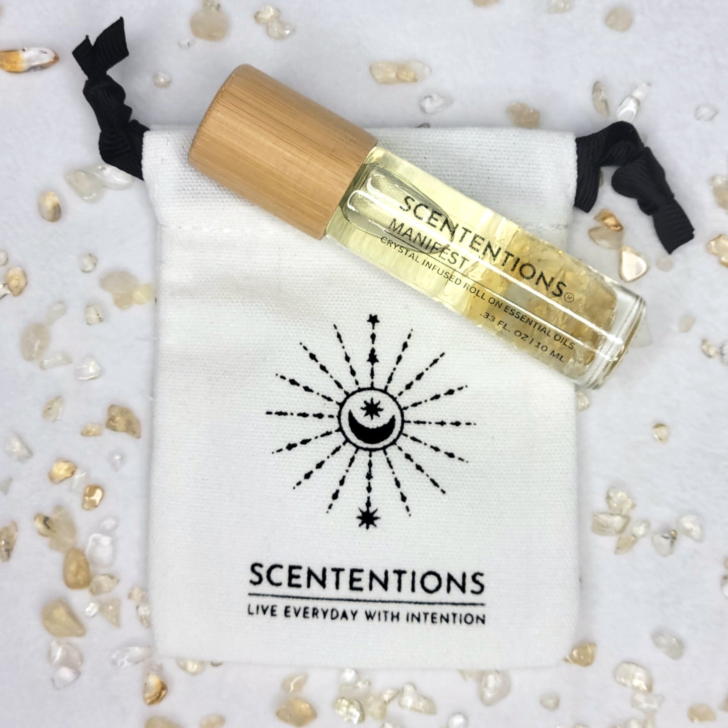 Manifest crystal oil roll-on with bamboo lid and mini canvas storage bag