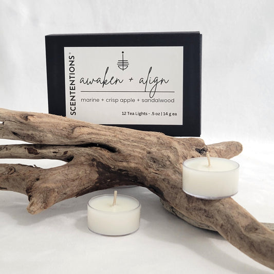 Awaken + Align tea light candle set with packaging on a neutral background.