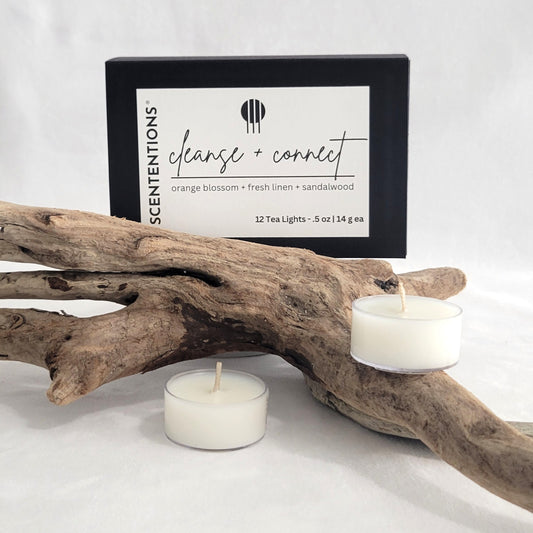 Cleanse + Connect tea light candle set with packaging on a neutral background.
