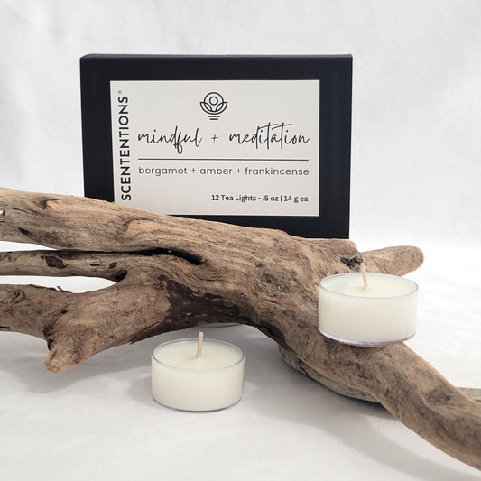 Mindful + Meditation tea light candle set with packaging on a neutral background.