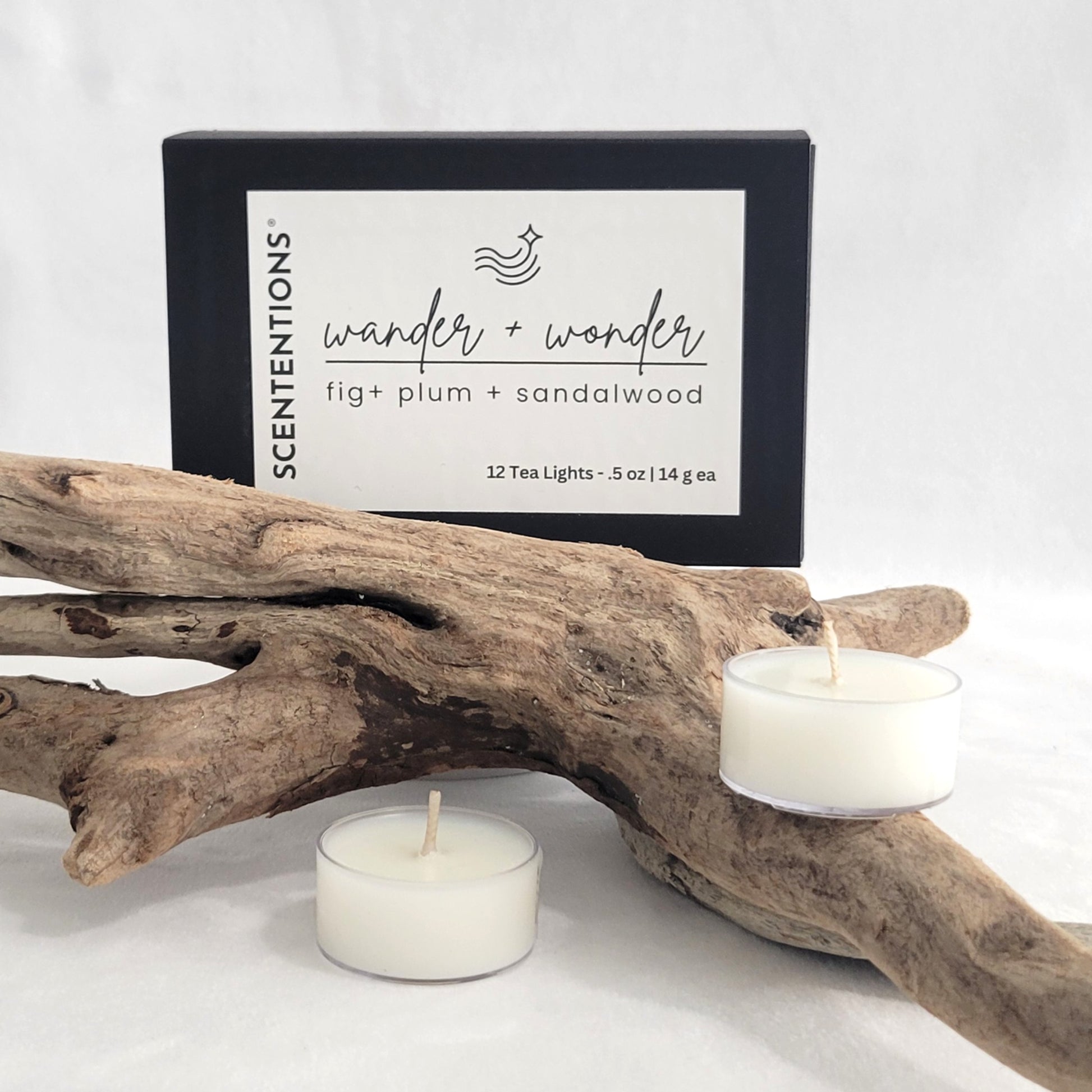 Wander + Wonder tea light candle set with packaging on a neutral background.