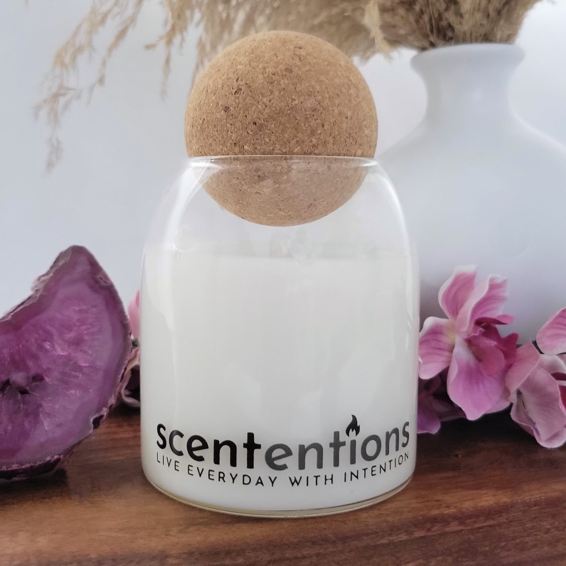 Balance + Bliss candle in reusable canvas tote, made with organic coconut wax, featuring ozone, sea salt, sweet blossoms, tonka, musk, and amber.