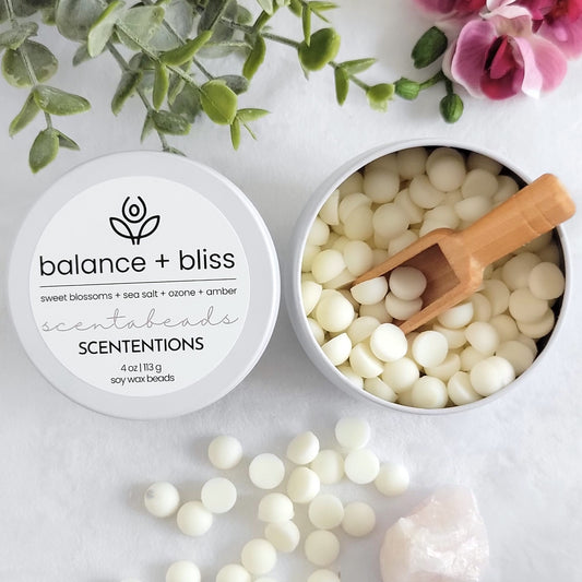 Balance + Bliss wax melt beads in eco-friendly tin with calming scent blend and reusable scoop by SCENTENTIONS
