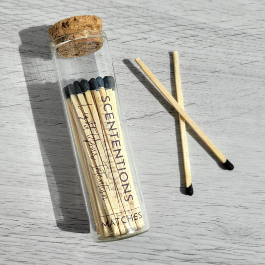 Black tip matches with loose matches on surface