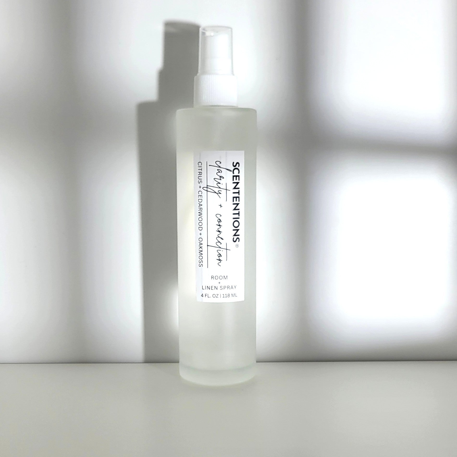  Clarity + Connection room spray featuring citrus, cedarwood, and oak moss notes for mental focus, clarity and grounding