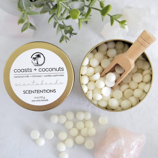 Coasts + Coconuts wax melt beads in eco-friendly tin with sunlit tropical scent blend and scoop by Scententions.