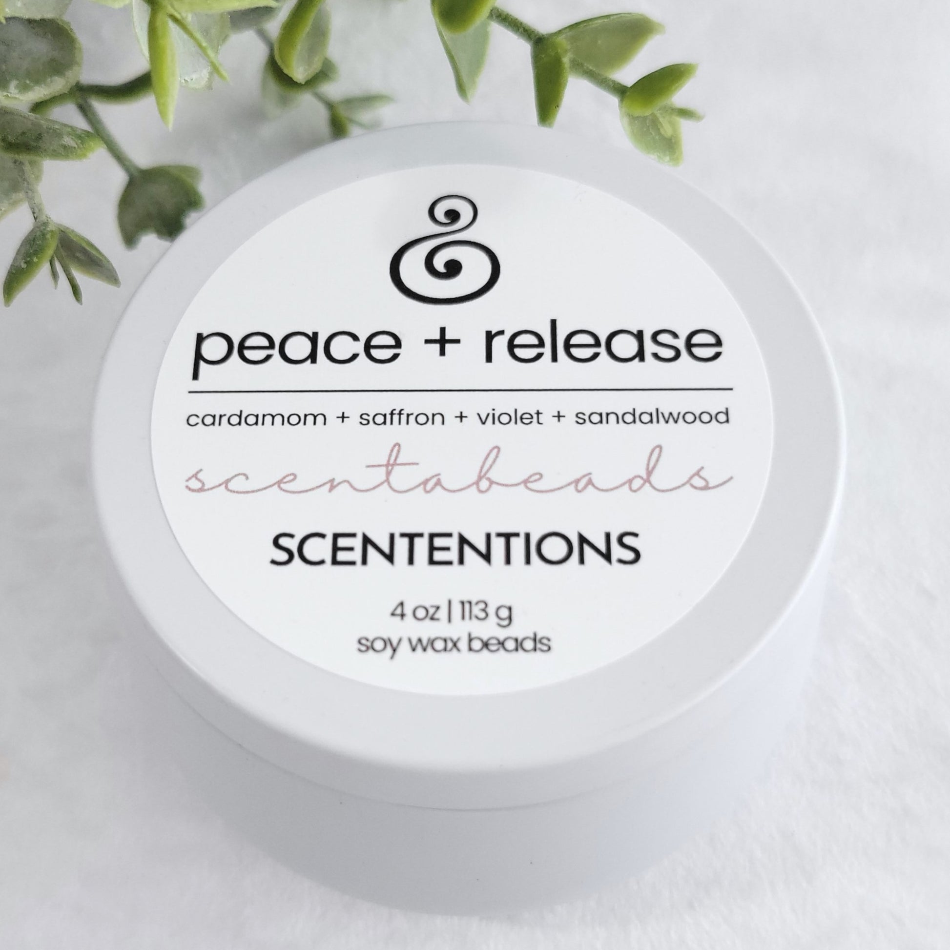 Peace + Release wax melt beads with Citrus, Cardamom & Palo Santo in eco-friendly packaging