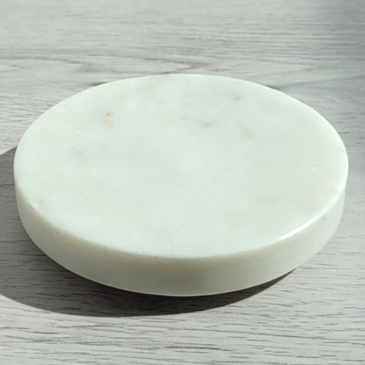 Round white marble candle coaster