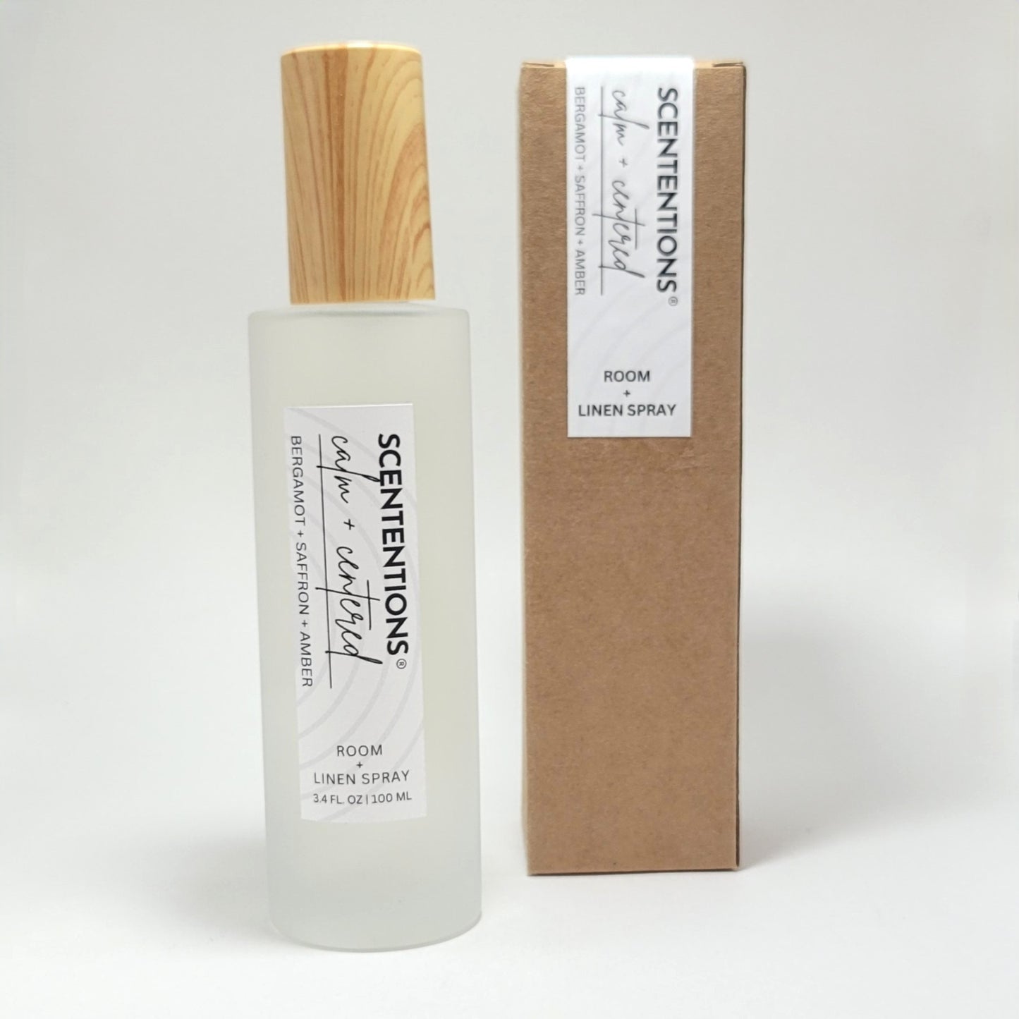 Calm + Centered room and linen spray with packaging box on white background.