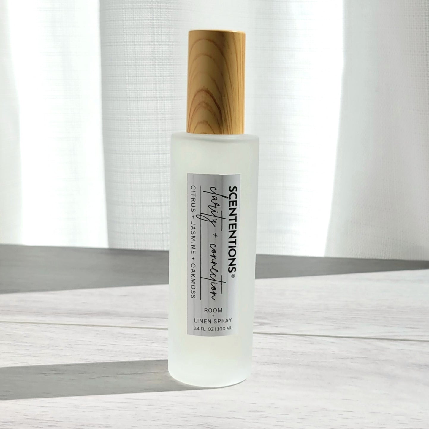 Scententions Clarity + Connection room and linen spray, frosted glass bottle with wood cap