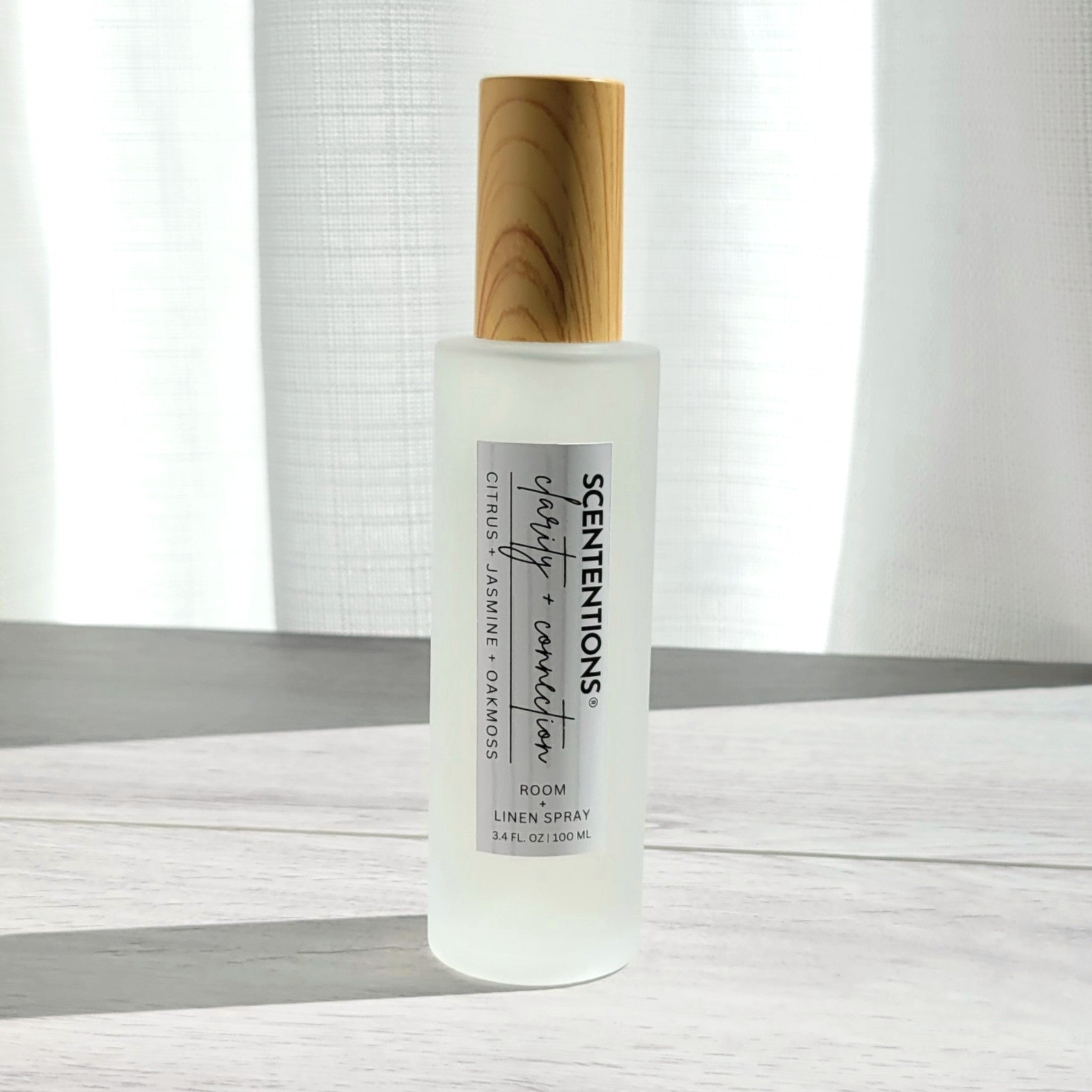 Scententions Clarity + Connection room and linen spray, frosted glass bottle with wood cap