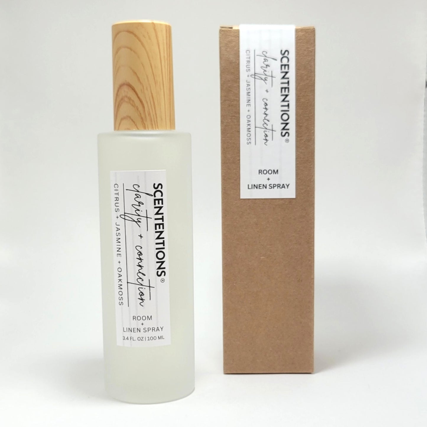 Clarity + Connection room and linen spray with packaging box on white background.