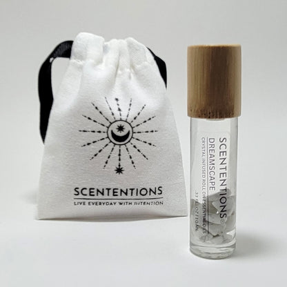 Crystal infused roll-on essential oil with Howlite crystals next to Scententions canvas pouch