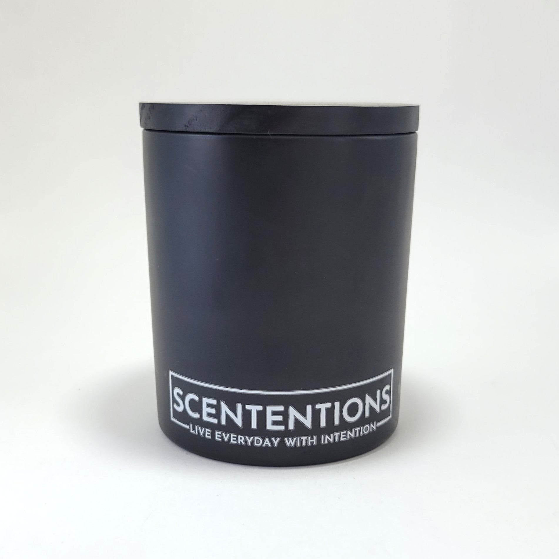 Moon Collection crystal coconut wax candle in matte black vessel with black wood lid on white background.