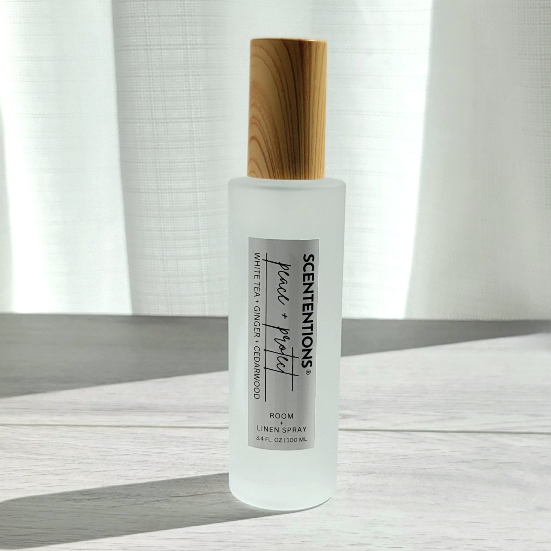 Scententions Peace + Protect room and linen spray, frosted glass bottle with wood cap