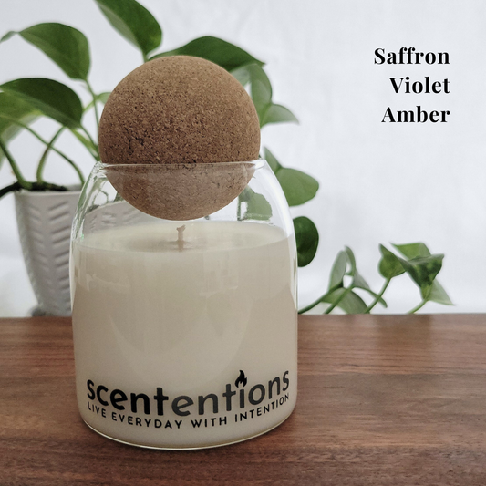 Peace + Release Signature Candle – a calming blend of saffron, violet, and amber designed to promote tranquility, grounding, and spiritual well-being.