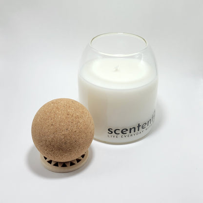 Coconut wax candle with removable cork lid and wooden stand.