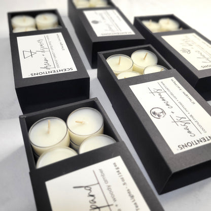 Tea Light Set featuring 12 organic coconut wax tea lights in black signature packaging by Scententions.