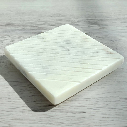 Square lined white marble candle coaster