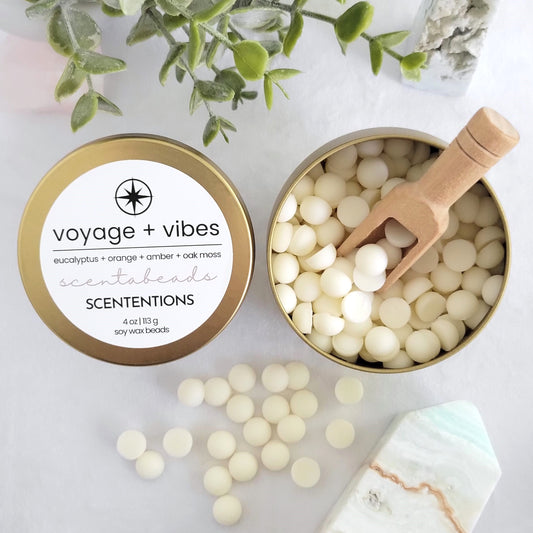 Voyage + Vibes wax melt beads in eco-friendly tin with refreshing forest and oceanic scent blend and scoop by Scententions